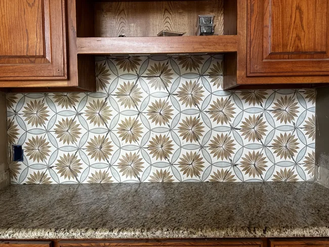 Decorative tile brings character to the space above the countertop.