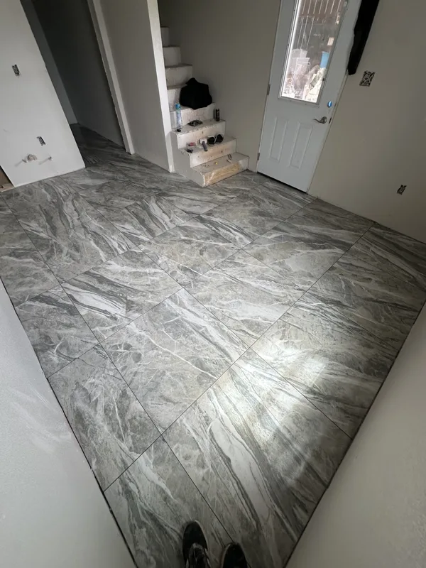 Large-format tile with a flowing stone pattern.