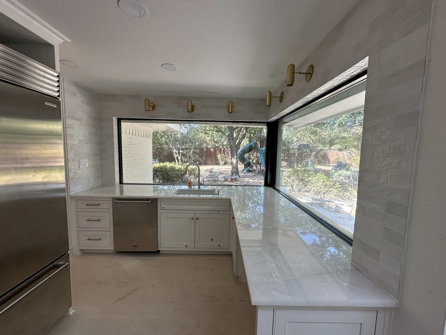 Light tile around a bright kitchen window